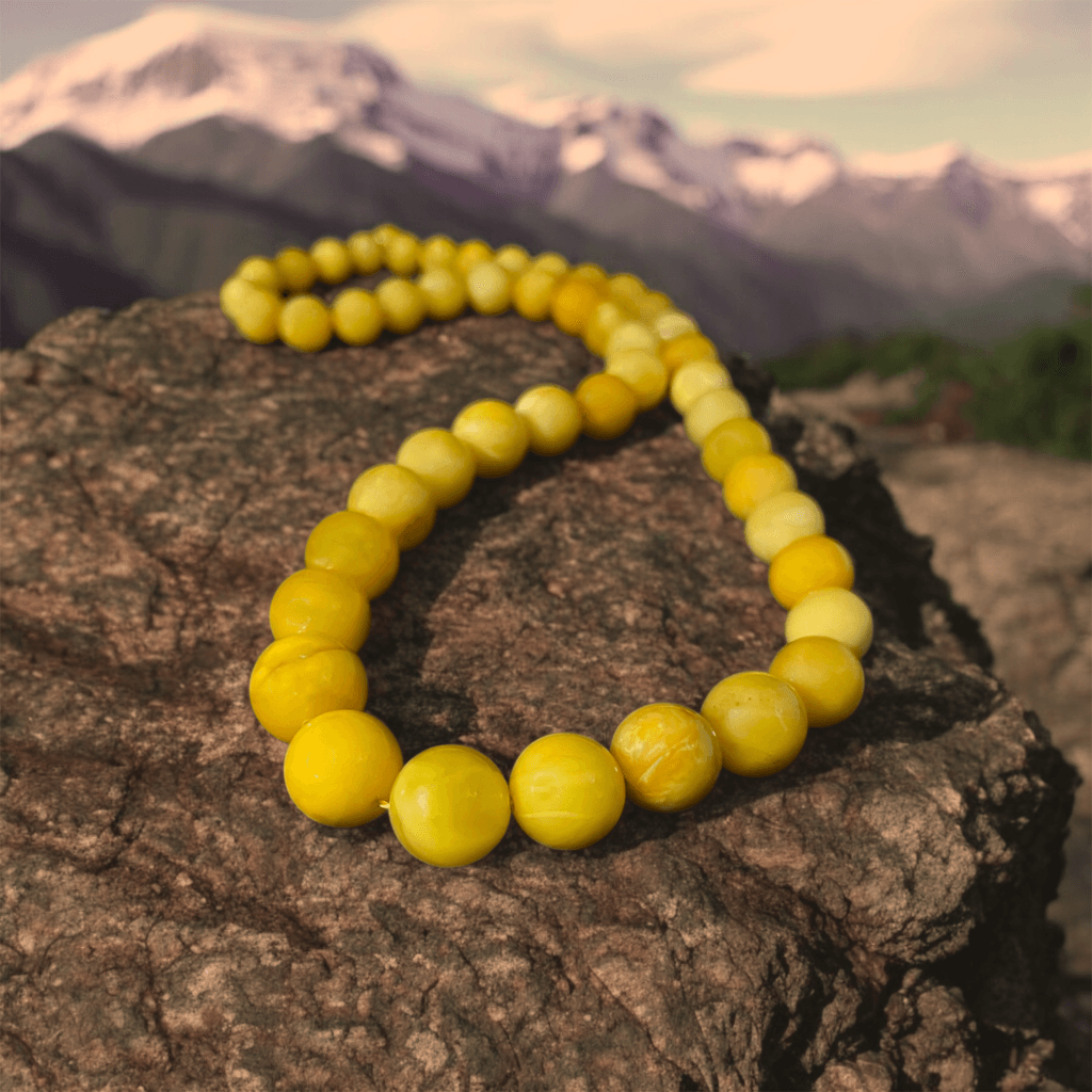 Polished yellow amber beads necklace showcasing rich natural tones and smooth craftsmanship.