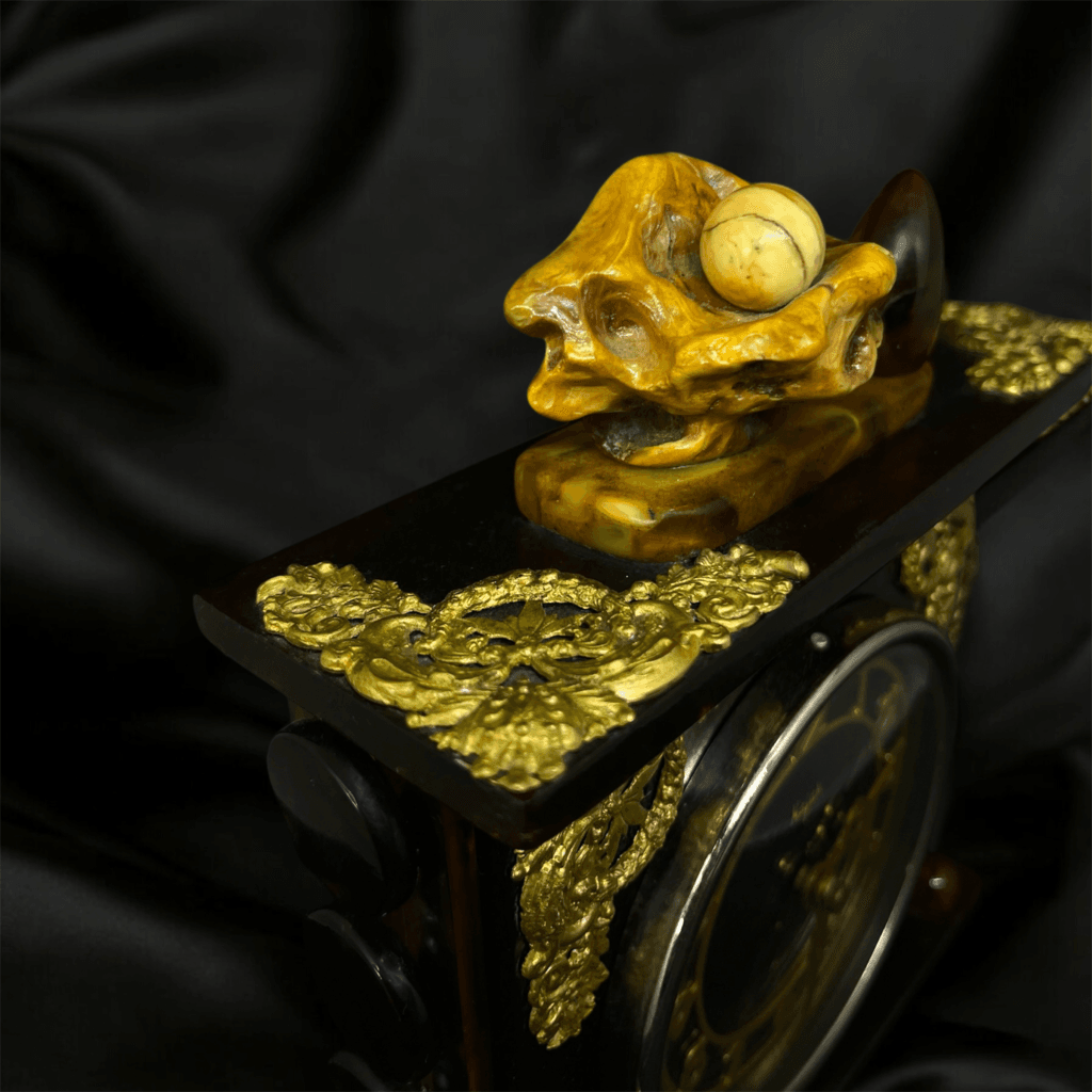 Detailed top view of Amber Time Symphony clock with a unique shell-shaped amber ornament