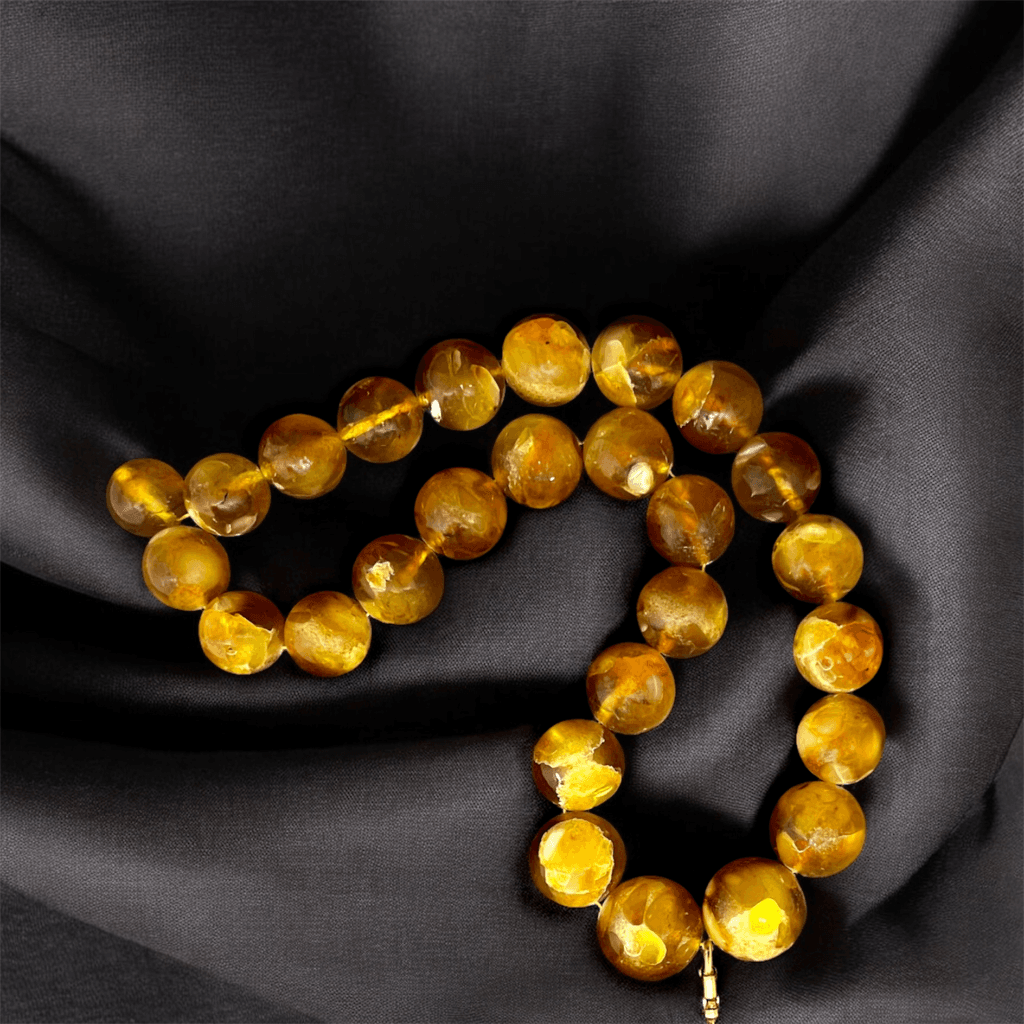 Timeless Amber Duo necklace detail – polished natural amber beads